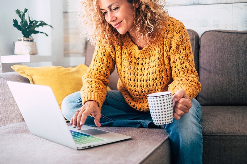 A woman applying for financing on her laptop